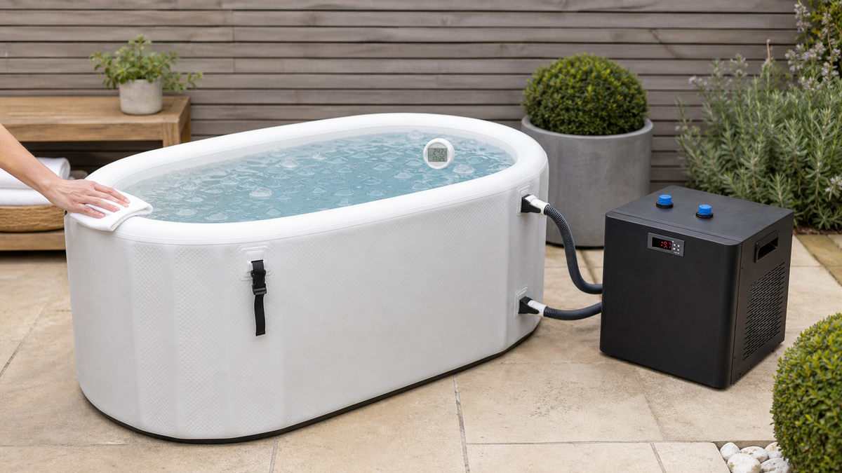 Long white ice bath connected to a black chiller with a floating thermometer on a UK garden terrace